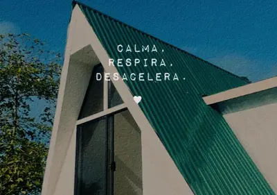 a building with a sign on the side of it at Moonlight Lodge in Cuatro Esquinas