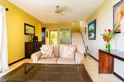 a living room with a couch and a table at Unique panoramic view and Central location! in Uvita