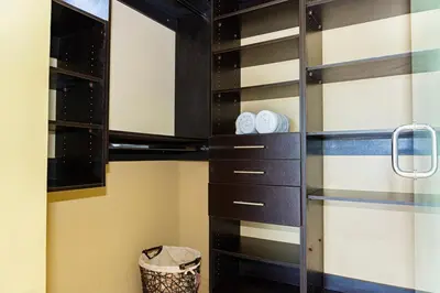 a walk in wine cellar with black and white cabinets at Unique panoramic view and Central location! in Uvita