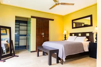 a bedroom with a bed and a mirror at Unique panoramic view and Central location! in Uvita