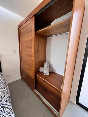 a room with a wooden closet with a bed at Guanacaste Marbella luxury home with a private pool in Santa Cruz