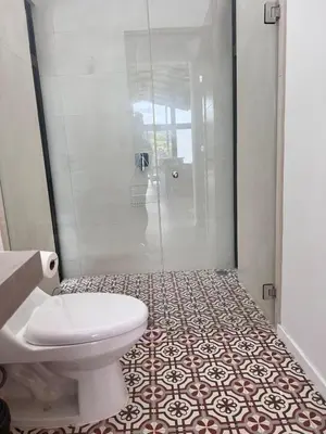 a bathroom with a white toilet and a shower at Guanacaste Marbella luxury home with a private pool in Santa Cruz