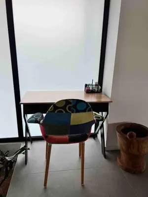 a chair sitting in front of a wooden table at Guanacaste Marbella luxury home with a private pool in Santa Cruz
