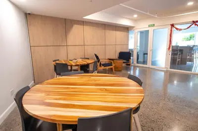 a conference room with a wooden table and chairs at Stylish 1-BR Oceanfront Condo with Panoramic Views in Jacó