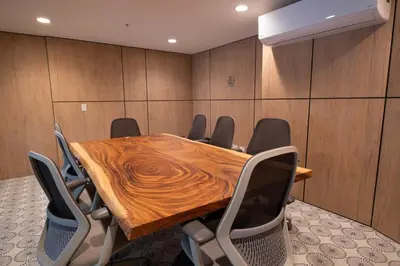a conference room with a wooden table and chairs at Stylish 2-BR Oceanfront Condo with Panoramic Views in Jacó