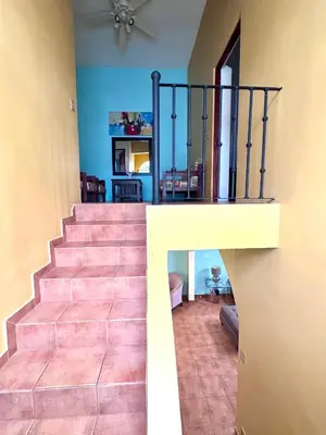 a staircase in a house with a stair railing at Three Bedroom Spacious Townhome in Coco