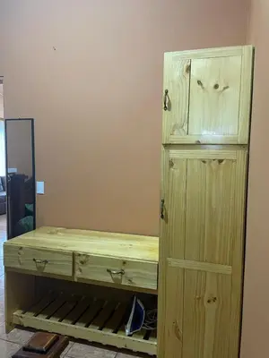 a wooden dresser in a room next to a cabinet at Fergust Family Studio Monteverde in Sierra