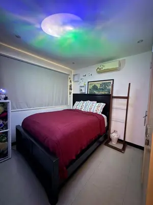 a bedroom with a bed with a purple ceiling at Casa residencial en playa Herradura in Herradura