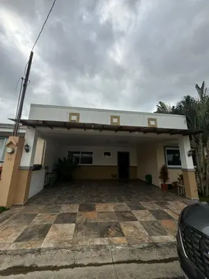 a car parked in front of a house at Casa residencial en playa Herradura in Herradura