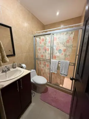 a bathroom with a shower with a toilet and a sink at Casa residencial en playa Herradura in Herradura