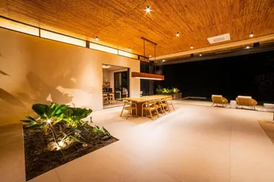 a dining room with a table and chairs in a room at Casa Lagom, Luxurious Oasis with Infinity Pool! in La Cruz
