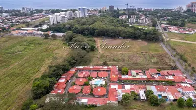 an aerial view of a building with red roofs at Villas jaco costa rica in Jacó