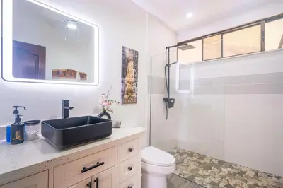 a bathroom with a shower and a sink and a toilet at Ocean Views-Private-Pool-Easy access-Ojochal-Gate in Ojochal
