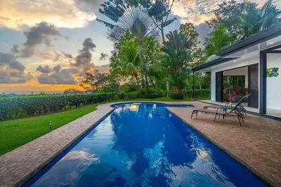 a swimming pool in the backyard of a house at Ocean Views-Private-Pool-Easy access-Ojochal-Gate in Ojochal