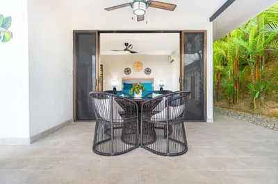 a dining room with a table and chairs at Ocean Views-Private-Pool-Easy access-Ojochal-Gate in Ojochal