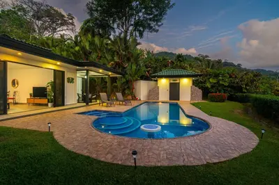 a swimming pool in the yard of a house at Ocean Views-Private-Pool-Easy access-Ojochal-Gate in Ojochal