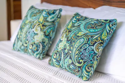 two pillows sitting on top of a bed at NEW! Luxury-4 Suites-Private pool-Ocean views in Coronado