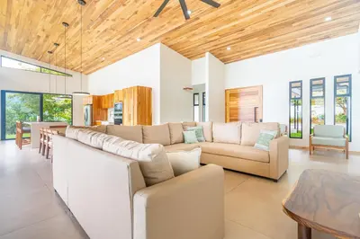 a living room with a couch and a table at NEW! Luxury-4 Suites-Private pool-Ocean views in Coronado