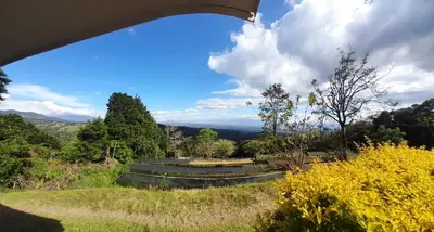 a view of a park with mountains in the background at Skyline Great View in Naranjo