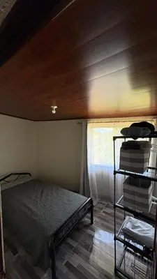 a bedroom with a bed and a wooden ceiling at Skyline Great View in Naranjo
