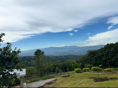a view of a valley from a hill at Skyline Great View in Naranjo