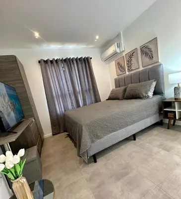 a bedroom with a bed in a room at Luxury New apartment! Infinity Pool! Adults only in Tapantí