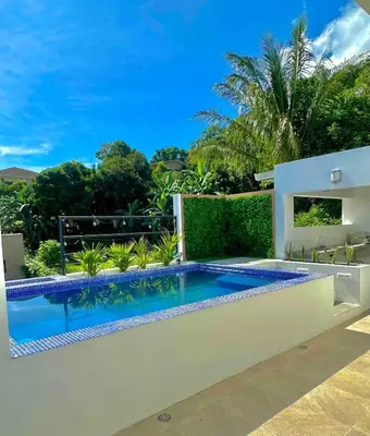 a swimming pool in the backyard of a house at Luxury New apartment! Infinity Pool! Adults only in Tapantí