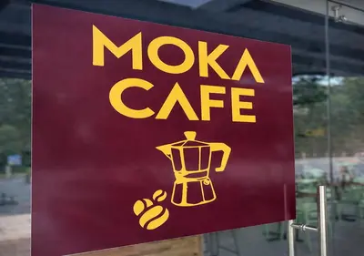 a sign for a moxka cafe on a window at Bird & Surf 2BD Retreat Jungle Views Pool Gym in Jacó