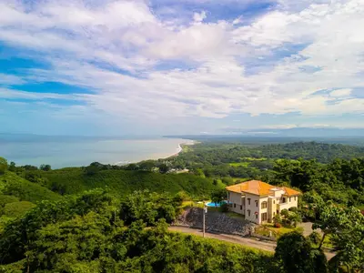 an aerial view of a house and a beach at 1hr SJO Airport-Ocean views-Gated Beachclub-Pool in Tarcoles