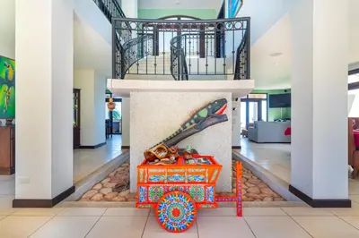a room with a skateboard in the middle of a building at 1hr SJO Airport-Ocean views-Gated Beachclub-Pool in Tarcoles