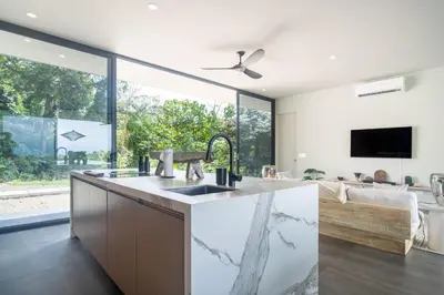 a kitchen with a sink and a large window at NEW! Modern-Luxury-3 suites-pool-Ojochal-100MBPS in Ojochal