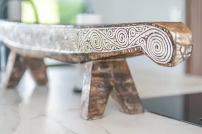 a wooden bench sitting on top of a table at NEW! Modern-Luxury-3 suites-pool-Ojochal-100MBPS in Ojochal