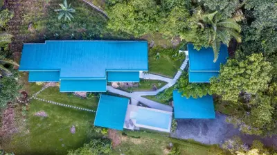 an overhead view of a house with blue roofs at 3 Suites-Views-Great pool-Near Dominical-Luxury in Laguna
