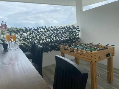 a chess board on a wooden table in a room at El Chante cerca de playas, piscinas y vistas a la montaña in Herradura