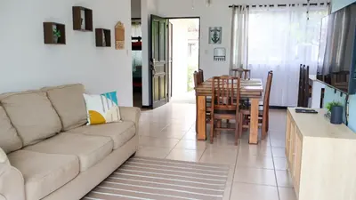 a living room with a couch and a table at Casa Brisa with a private pool in Bejuco in Bejuco