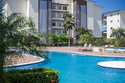 a swimming pool in front of a building at Casa Brisa with a private pool in Bejuco in Bejuco