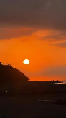 a sunset on the beach with the sun setting at Casa Brisa with a private pool in Bejuco in Bejuco
