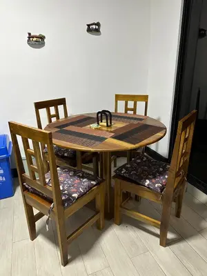 a wooden table with two chairs and a table with at En-suite Paraiso #1 in Parrita