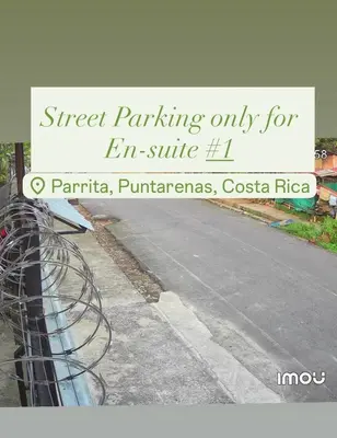 a sign that says street parking only for en suite at En-suite Paraiso #1 in Parrita