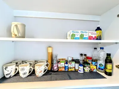 a shelf in a refrigerator filled with food and drinks at Upscale Tropical Retreat - 4BR in Gated Resort in Jacó