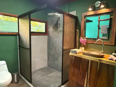 a bathroom with a shower and a sink at Java blue banana in Santa Cruz