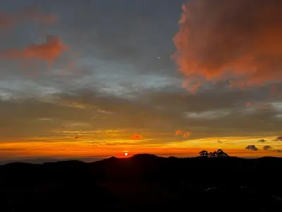 a sunset on the top of a mountain at Monteverde Sunset House in Cebadilla