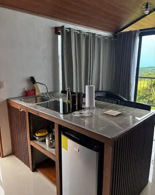 a kitchen with a sink and a counter top at Monteverde Sunset House in Cebadilla