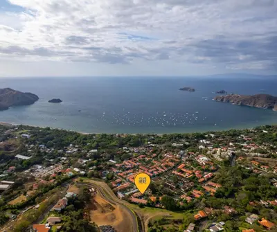 an aerial view of a city and the ocean at 2-BD Condo with Pool, Walk to Beach in Coco