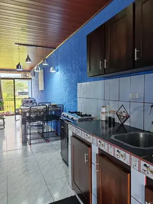 a kitchen with a sink and a counter top at YAIZA HOUSE Jaco in Jacó