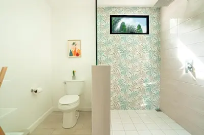 a bathroom with a toilet and a shower at 3BR Peaceful Retreat Walking Distance to Beach in Tamarindo