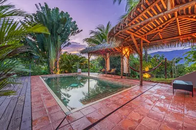 an image of a house with a swimming pool at Chalet Jardin Tropical in Ojochal