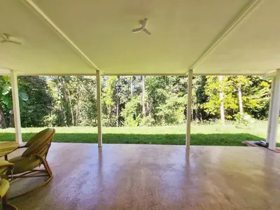 a white tent with a chair and a ceiling fan at Casa Ballena with Beach Access and Private Pool in Uvita