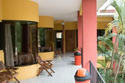 a lobby of a building with chairs and tables at Hotel Nany in Brasilito