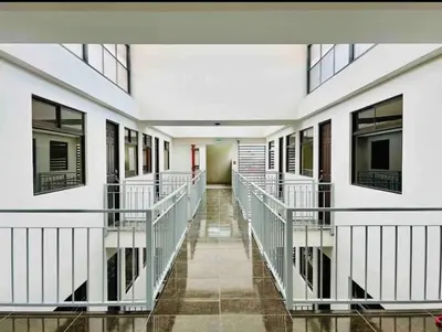 an empty hallway of a building with windows at Moderno apartamento en San Jose CR in San José